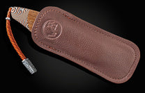 Handcrafted William Henry knife features a frame in hand-forged mokume gane by Mike Sakmar