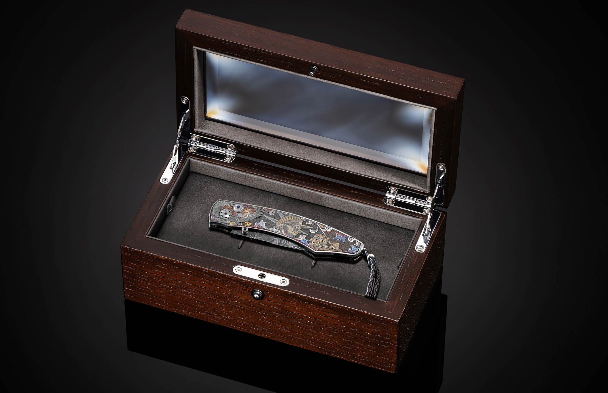 Handcrafted William Henry knife features color laser and hand-engraving work by Bottega Incisioni