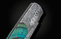 Handcrafted pocket knife from William Henry hand-engraved by Frederique Lepinois