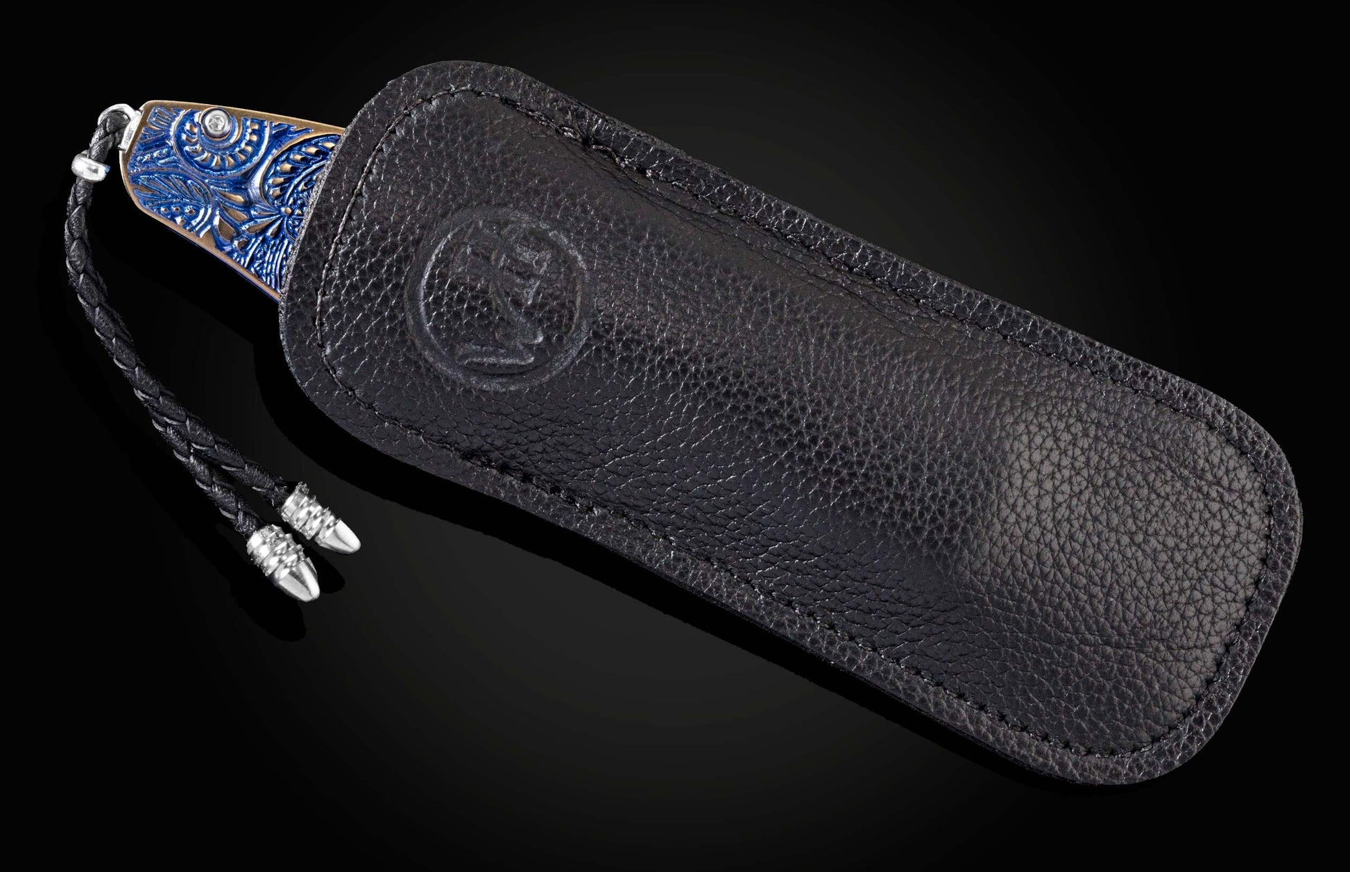 Custom William Henry knife featuring blue anodized titanium handle with high detail paisley design