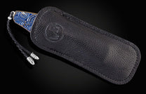 Custom William Henry knife featuring blue anodized titanium handle with high detail paisley design