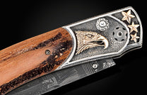 Custom knife from William Henry with hand-carved sterling silver & gold eagle by Lee Downey