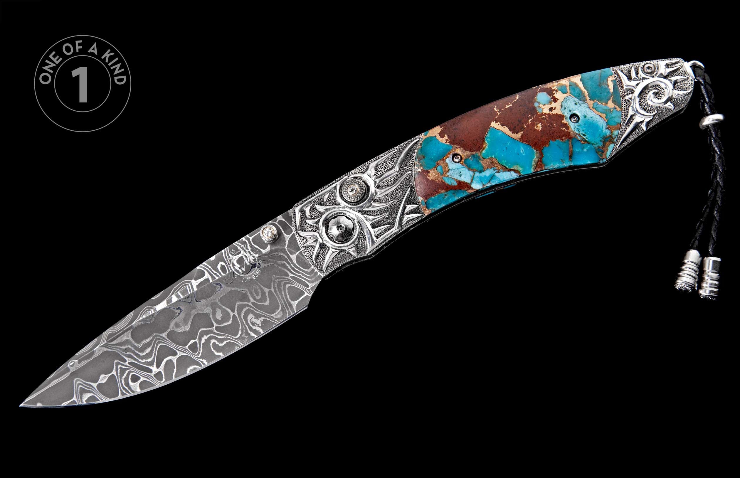 Damascus steel knife with an ornate silver handle featuring turquoise and reddish-brown stone inlay and a black leather lanyard.