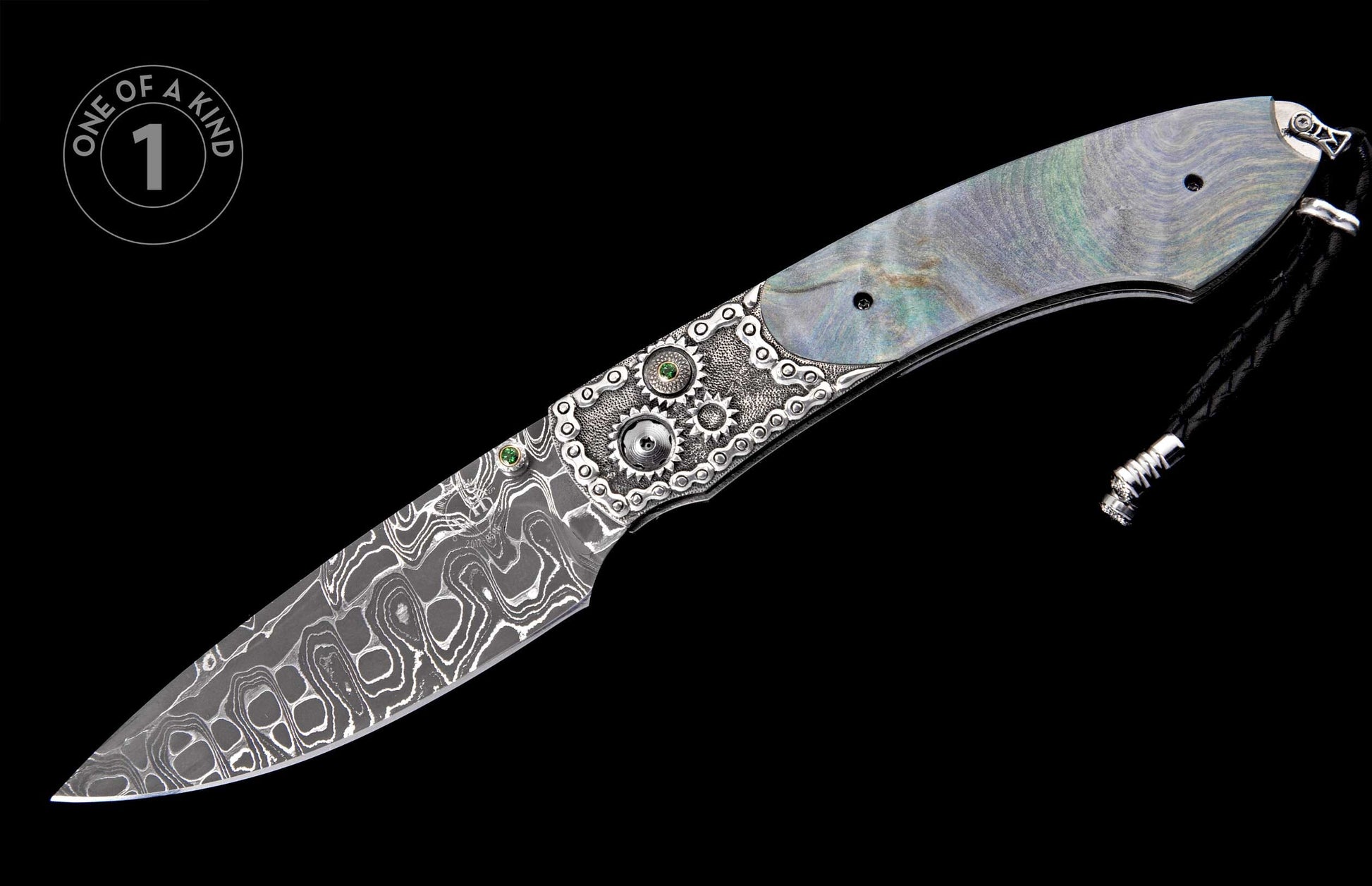 Ornate folding knife with iridescent mother-of-pearl handle, silver gear and chain link details with green gems, wavy Damascus blade, and black lanyard.
