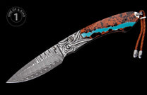 Damascus steel folding knife with an ornate silver bolster, a brown and black handle featuring a turquoise stripe, and a braided leather lanyard.