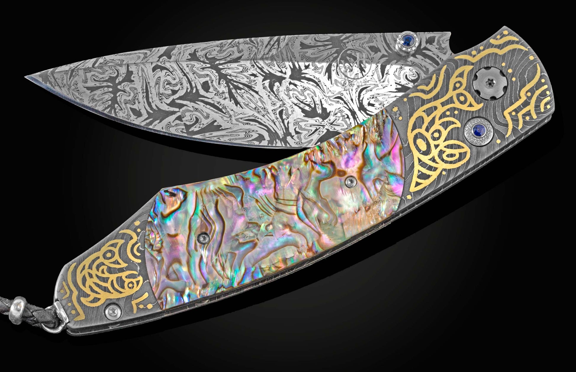 Handcrafted William Henry knife hand-forged damascus frame by Chad Nichols, hand-engraved with 18k green gold by Tyler Prince, and inlaid with abalone shell, sapphires, and a hand-forged  damascus steel blade by Luke Mattern