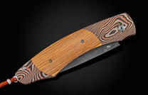Handcrafted pocket knife from William Henry with a frame of hand-forged 'Twist' mokume by Mike Sakmar