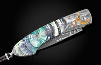 Custom William Henry knife featuring hand-engraved ducks in 24K yellow and 18K green gold