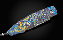  Kashimir Blue topaz and a hand-forged Damascus Steel blade by Chad Nichols.