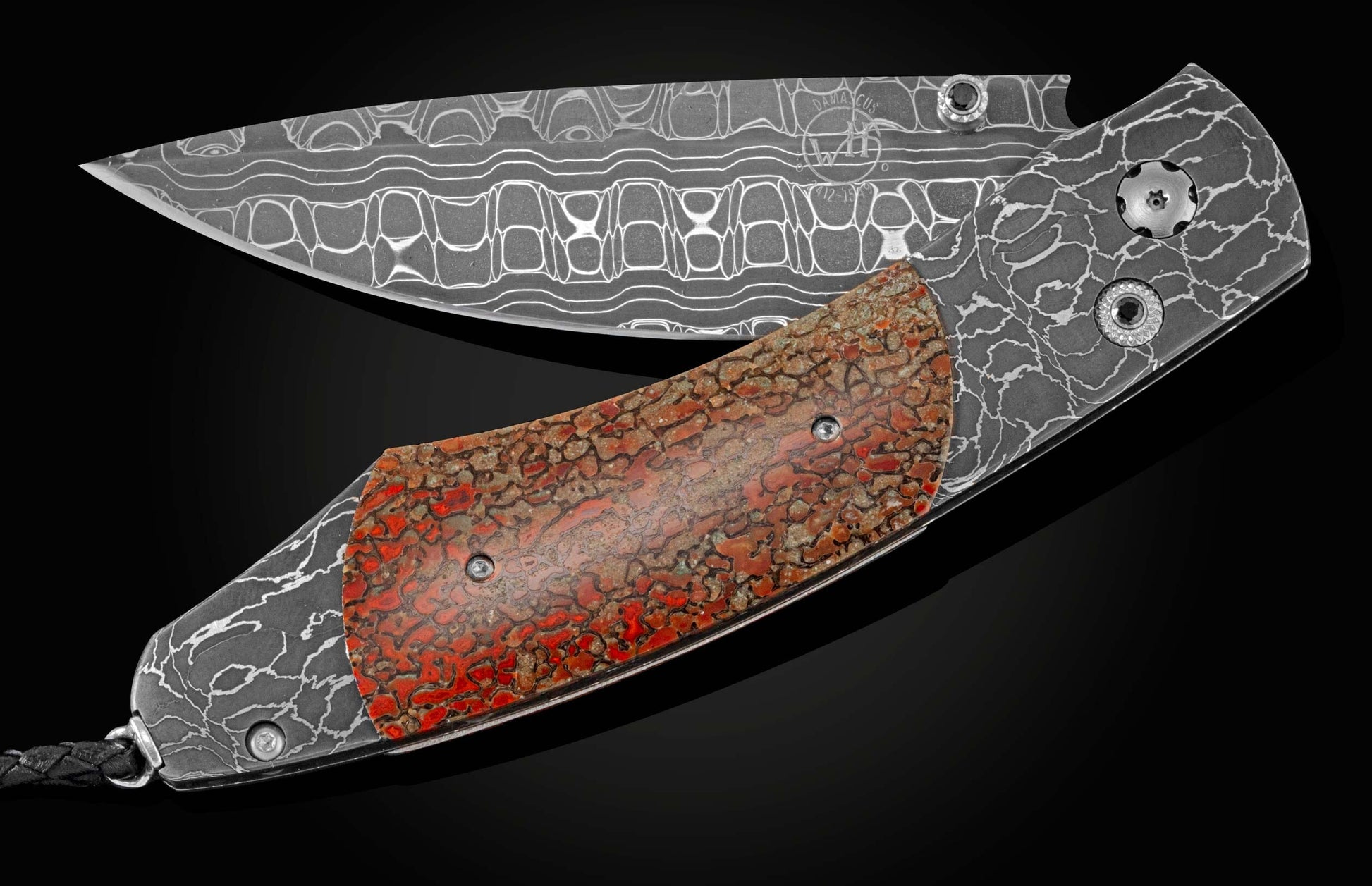 Handcrafted pocket knife from William Henry featuring a frame in hand-forged Damascus steel, inlaid with a mesmerizing piece of fossil dinosaur bone (from an Apatosaurus that walked the Earth 100 million years ago). The blade is hand-forged Damascus steel