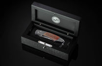  inlaid with a mesmerizing piece of fossil dinosaur bone (from an Apatosaurus that walked the Earth 100 million years ago). The blade is hand-forged Damascus steel