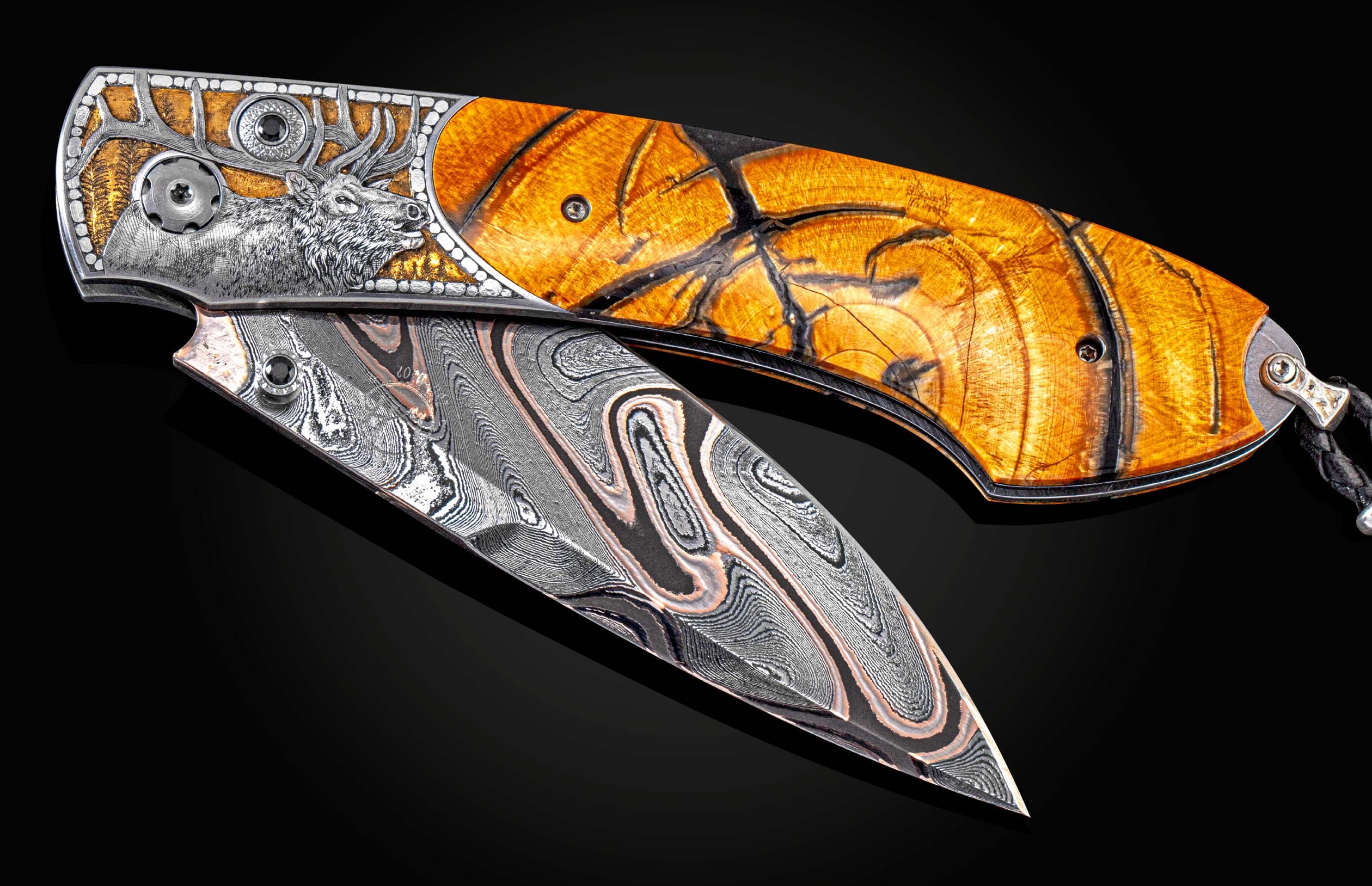 Handcrafted William Henry knife with hand-engraved depiction of elk with 24K gold inlays by Anna Sebestova, fossil Woolly Mammoth tusk, spinel gemstones, and a damascus steel blade