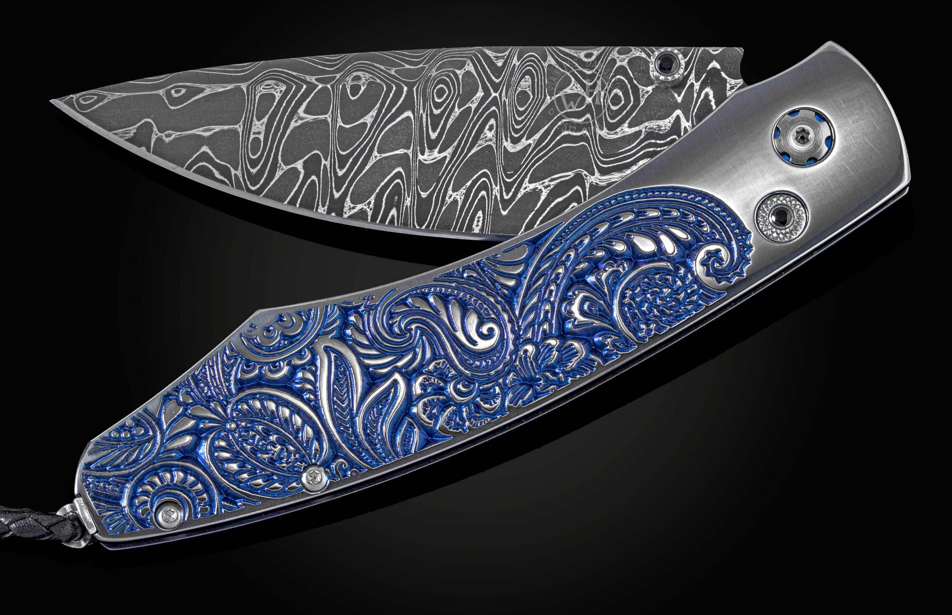 Handcrafted William Henry pocket knife featuring blue & silver anodized titanium handle with high detail micro machining, spinel gemstones, and a hand-forged  damascus steel blade by Chad Nichols