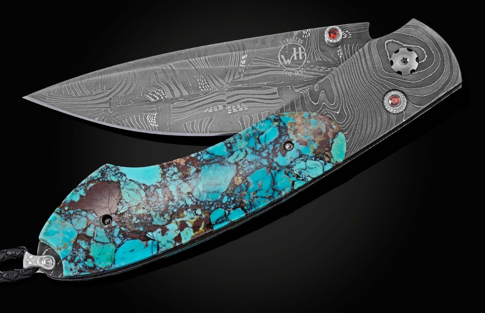 Handcrafted pocket knife from William Henry with a frame in hand-forged Damascus steel inlaid with black Matrix Kingman turquoise and set with garnets. The blade is hand forged damascus steel