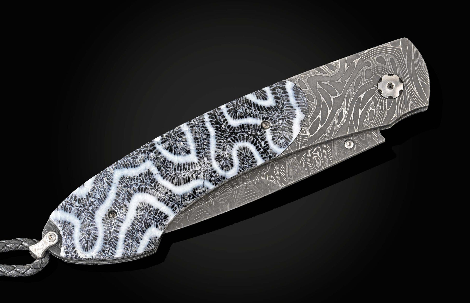 Handcrafted William Henry custom knife featuring fossil coral scales