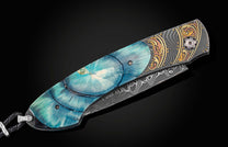  inlaid with a brilliant blue ring-cut of 10