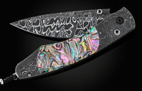 The Rip Tide Folding Knife with Hand-Forged Damascus and Abalone Shell