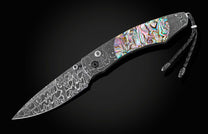 The Rip Tide Folding Knife with Hand-Forged Damascus and Abalone Shell