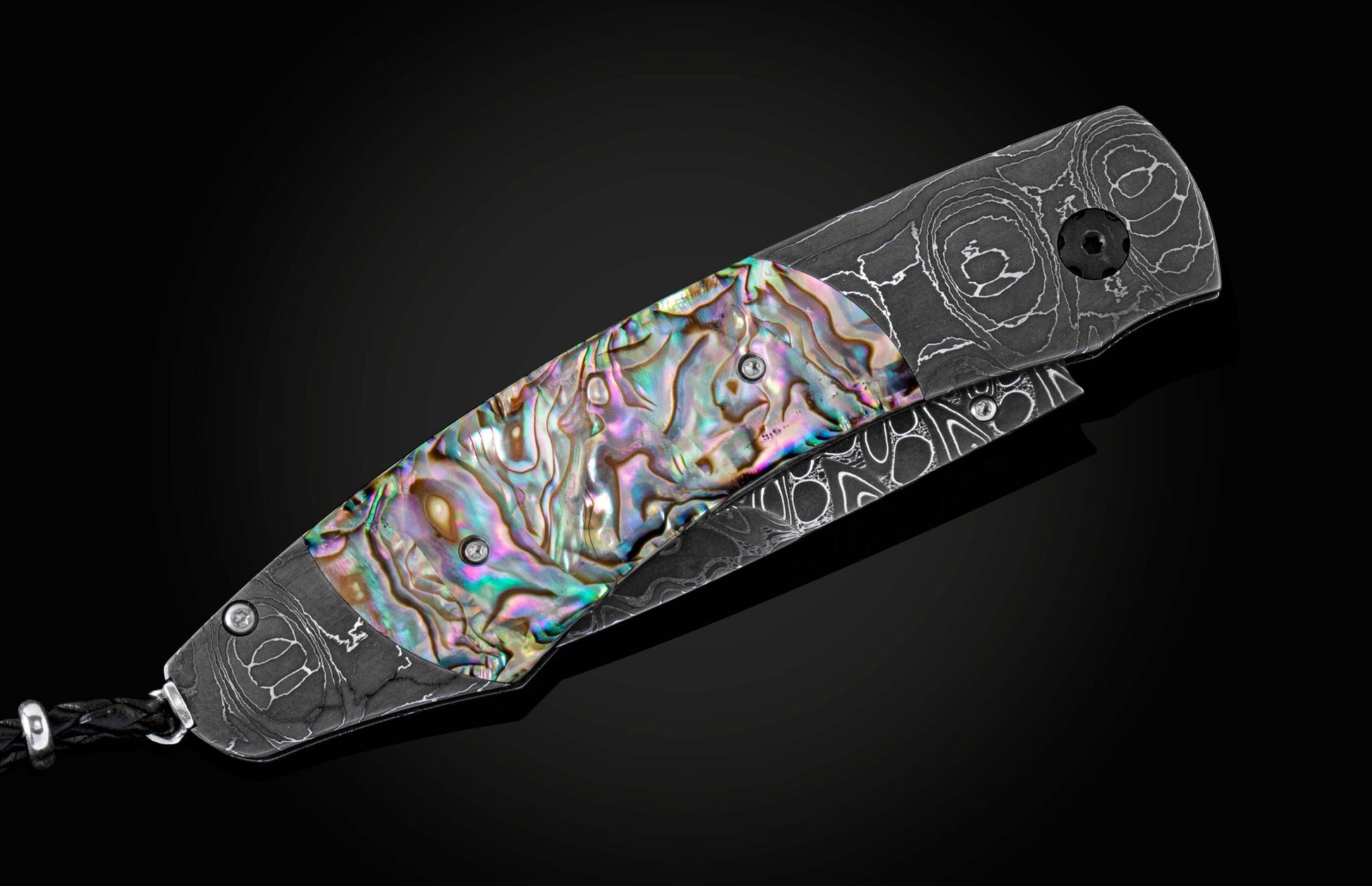 The Rip Tide Folding Knife with Hand-Forged Damascus and Abalone Shell