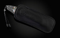 The Rip Tide Folding Knife with Hand-Forged Damascus and Abalone Shell in a leather case