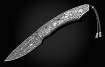  and a hand-forged Damascus steel blade by Chad Nichols