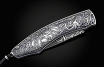 Handcrafted pocket knife from William Henry features a hand-engraved  stainless steel frame by Mick Butterworth