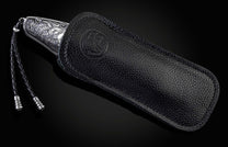  and a hand-forged Damascus steel blade by Chad Nichols