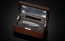 Handcrafted pocket knife from William Henry features a hand-engraved  stainless steel frame by Mick Butterworth