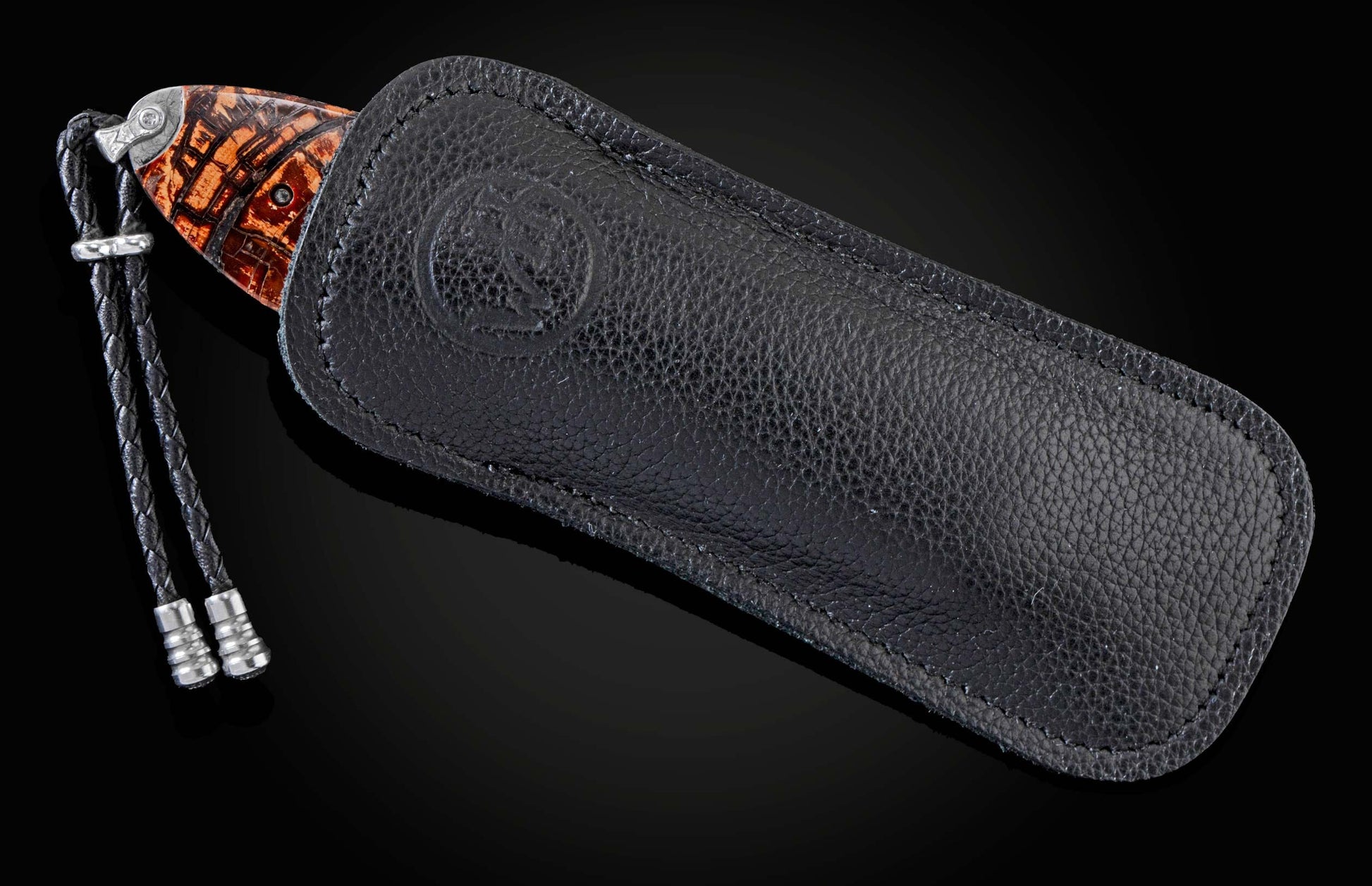 Handcrafted pocket knife from William Henry featuring hand-engraved images of Sharps rifle with copper