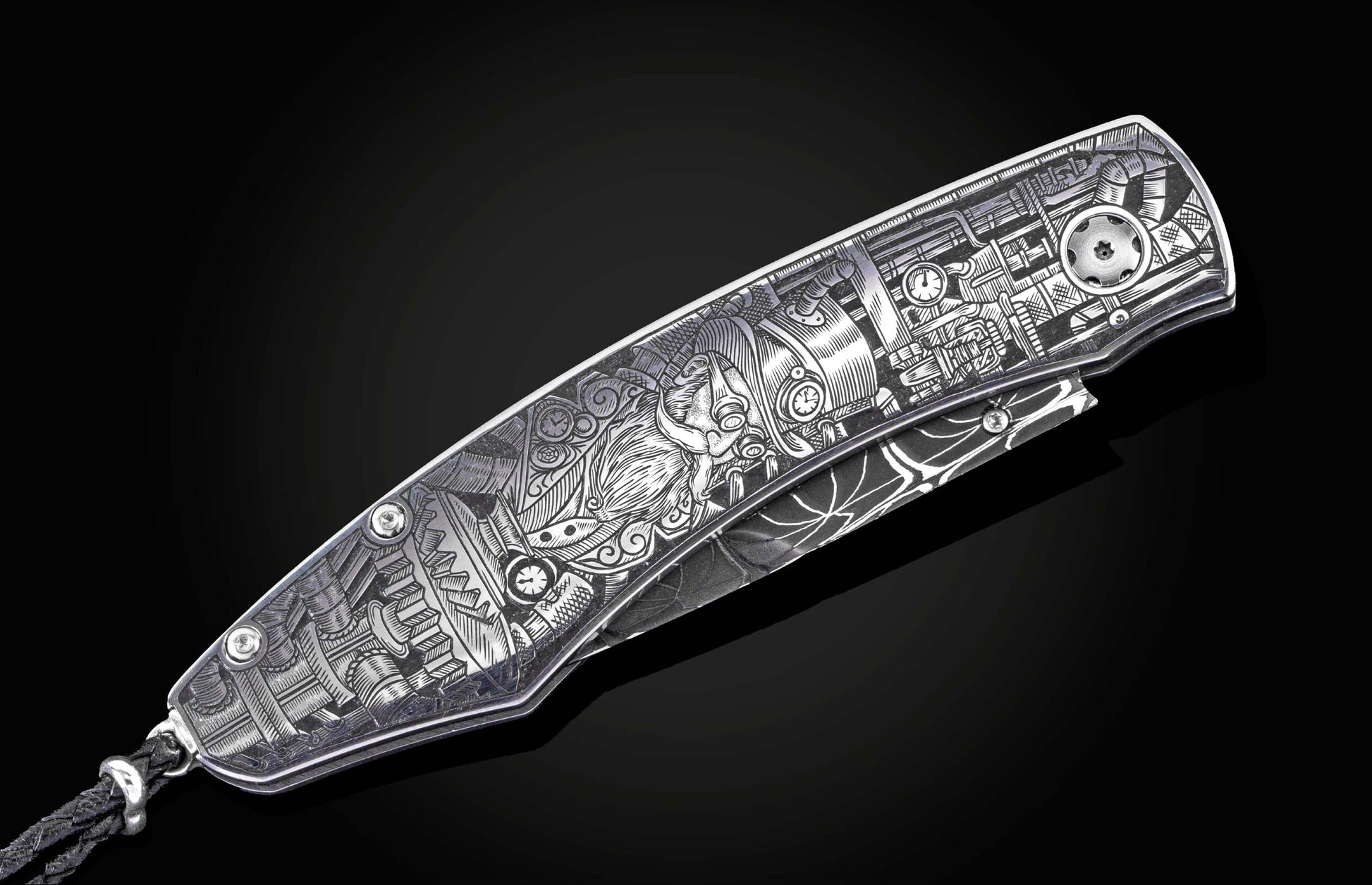 Silver-toned metal knife with intricate Steampunk-style engraving of gears, pipes, and a horned figure, featuring a braided lanyard, angled view.