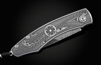 Handcrafted pocket knife from William Henry featuring an engraved tribal motif