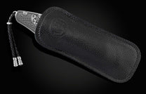  a hand-forged Damascus steel blade