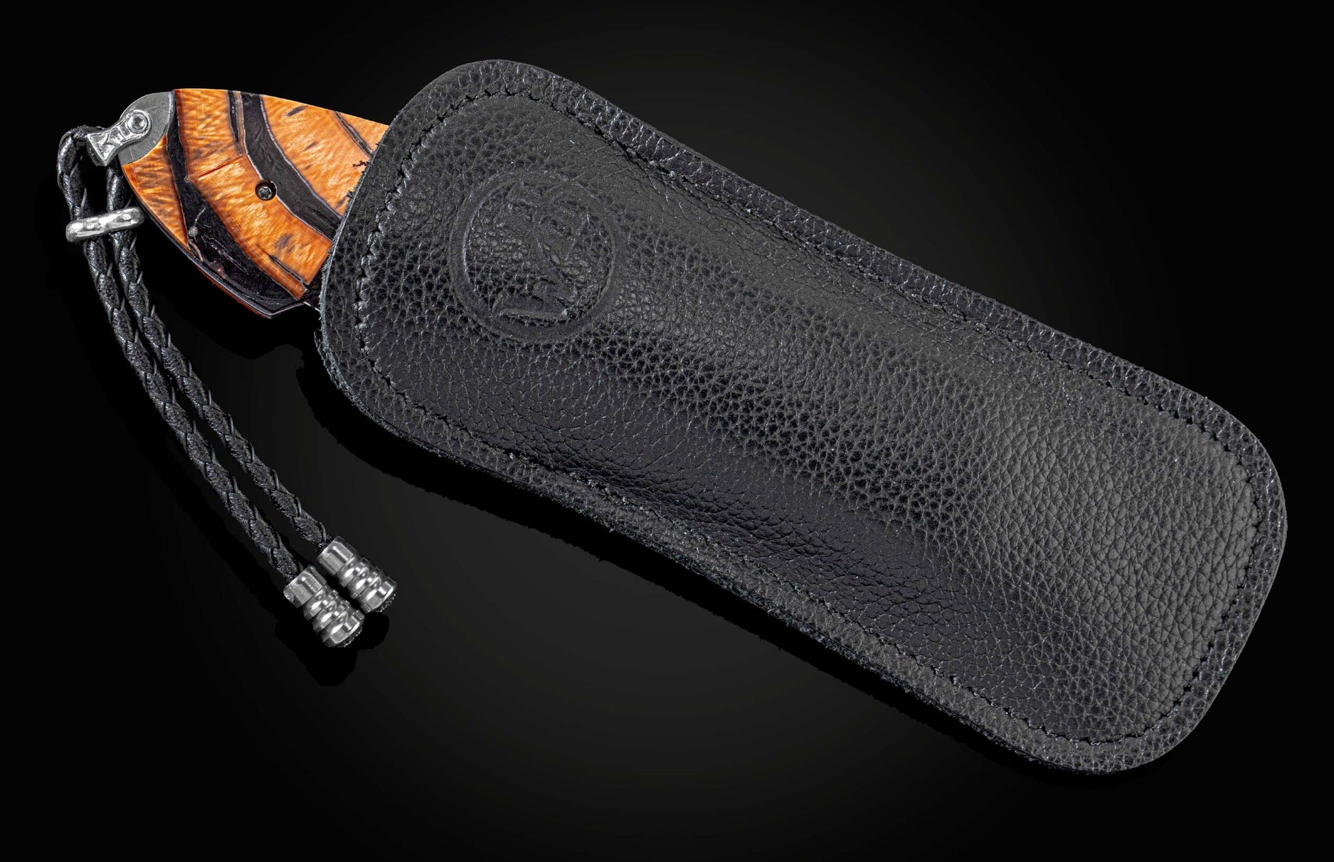Handcrafted knife by William Henry with hand-engraved frame