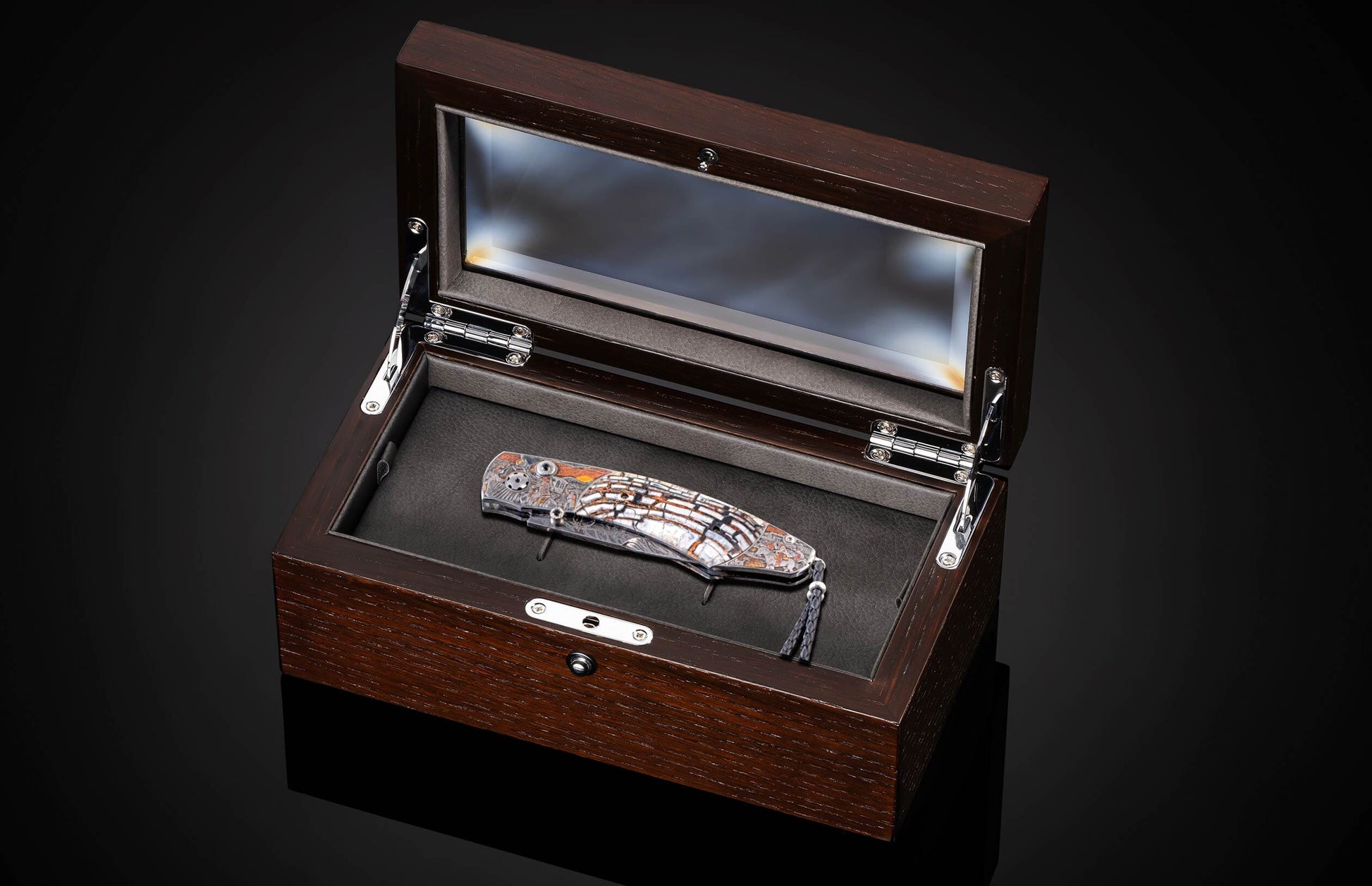 Handcrafted William Henry knife with hand engraved frame depicting a train robbery in 24K gold