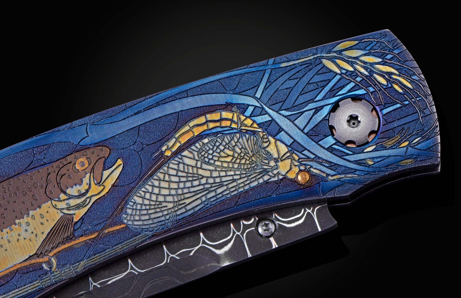  with inlaid 24K gold depicting a trout and fly fishing gear. The blade is hand-forged Damascus Steel and the button lock and the thumb stud are set 