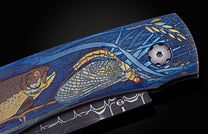  with inlaid 24K gold depicting a trout and fly fishing gear. The blade is hand-forged Damascus Steel and the button lock and the thumb stud are set 