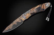  copper and tombac inlays with fossil Woolly Mammoth tusk. The blade is hand-forged Damascus steel with a striking black and copper pattern. The button 