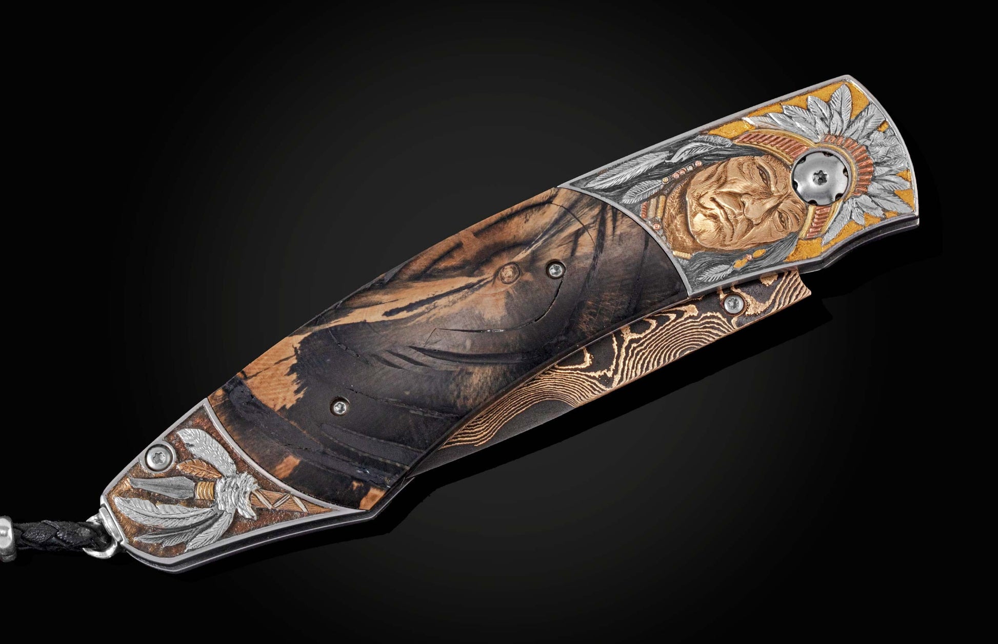 Handcrafted pocket knife from William Henry features a hand-engraved frame with 24K & 22K gold