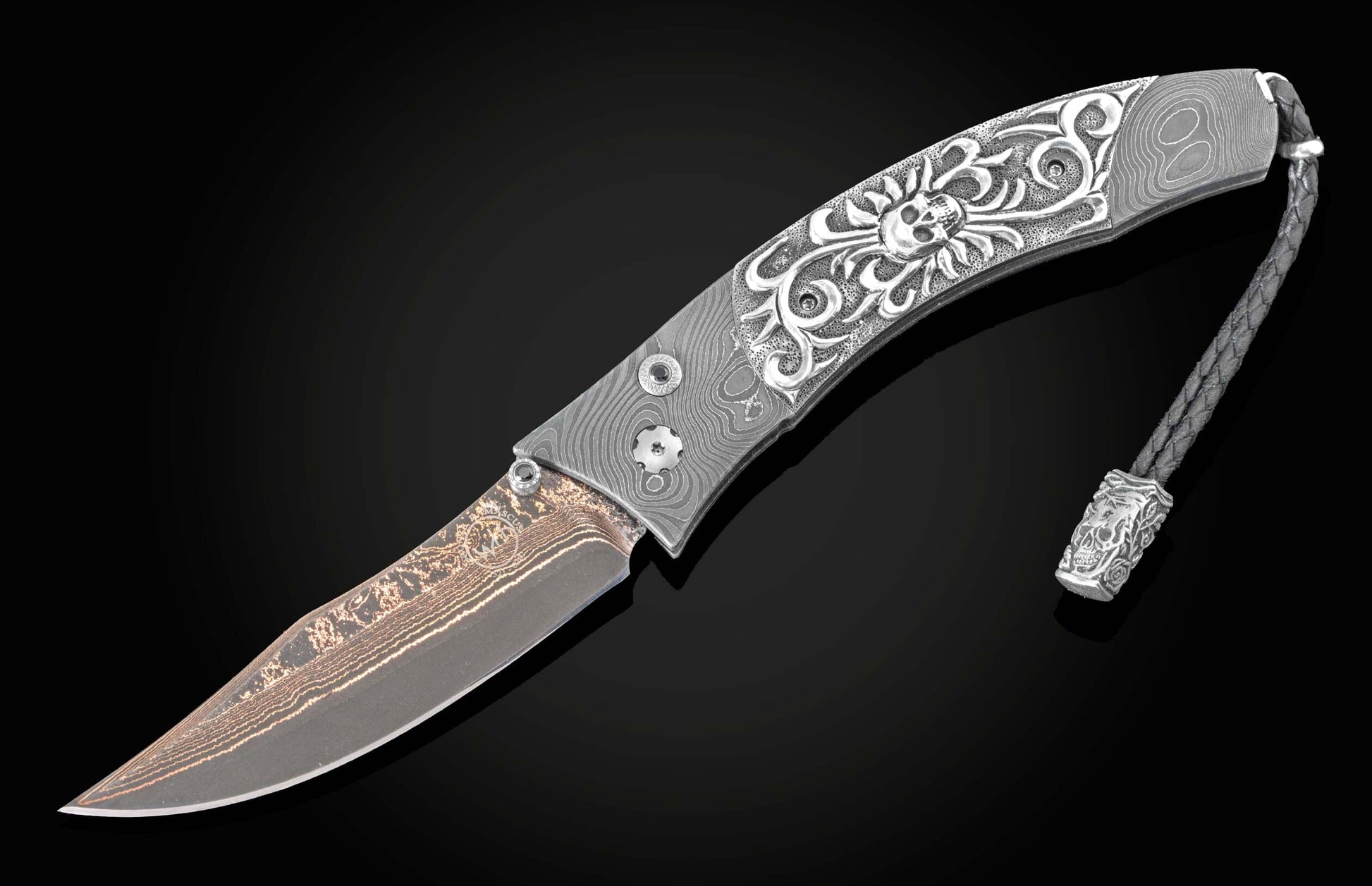  and a hand forged Damascus steel blade by Baker Forge.