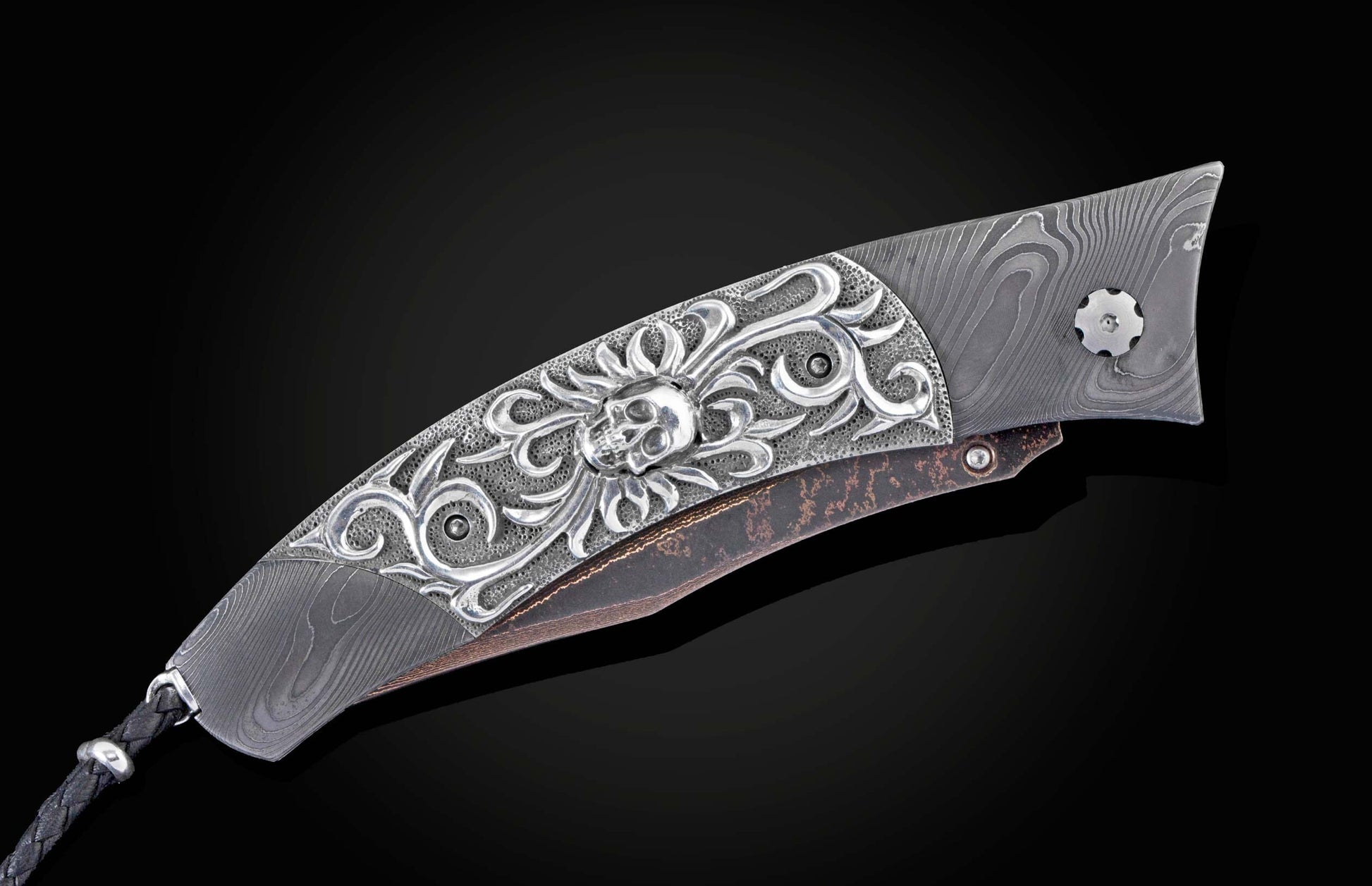 Custom William Henry knife featuring a frame in hand forged Damascus steel by Chad Nichols