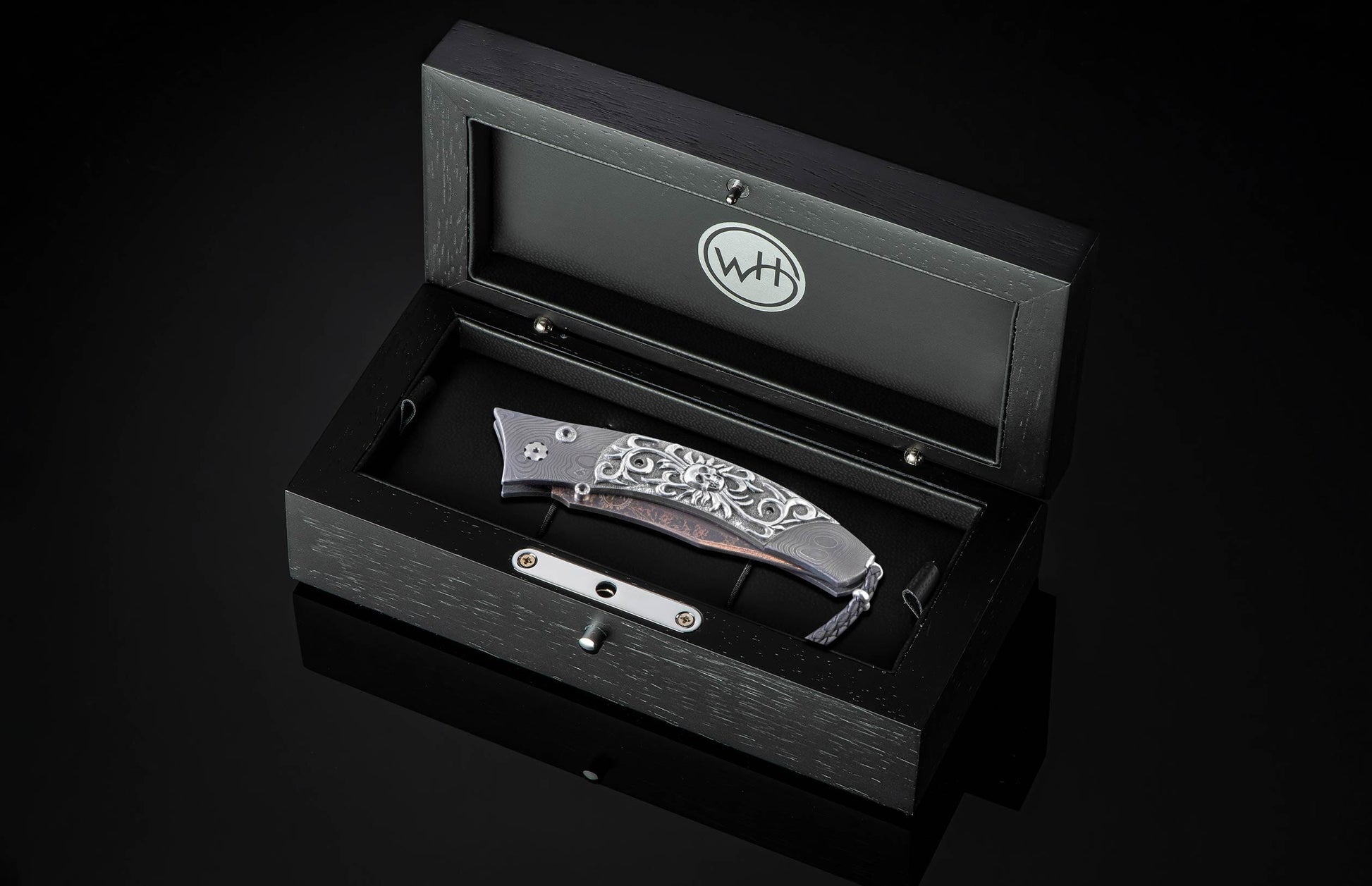  and a hand forged Damascus steel blade by Baker Forge.