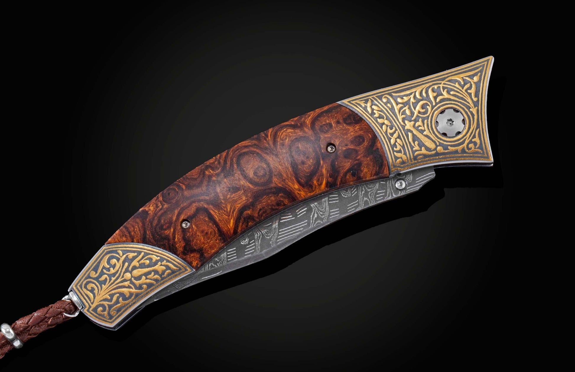  inlaid with desert ironwood. The blade is hand-forged  Damascus steel and the  button lock and the thumb stud are set with citrine gemstones.