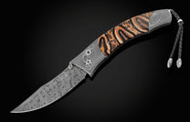 This hand crafted knife from William Henry features a frame in hand forged Damascus steel