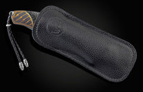  spinel gemstones and a hand-forged 'Hornets Nest' Damascus steel blade by Mike Norris.