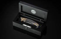 Handcrafted pocket knife from William Henry featuring a frame in 24K gold Koftgari