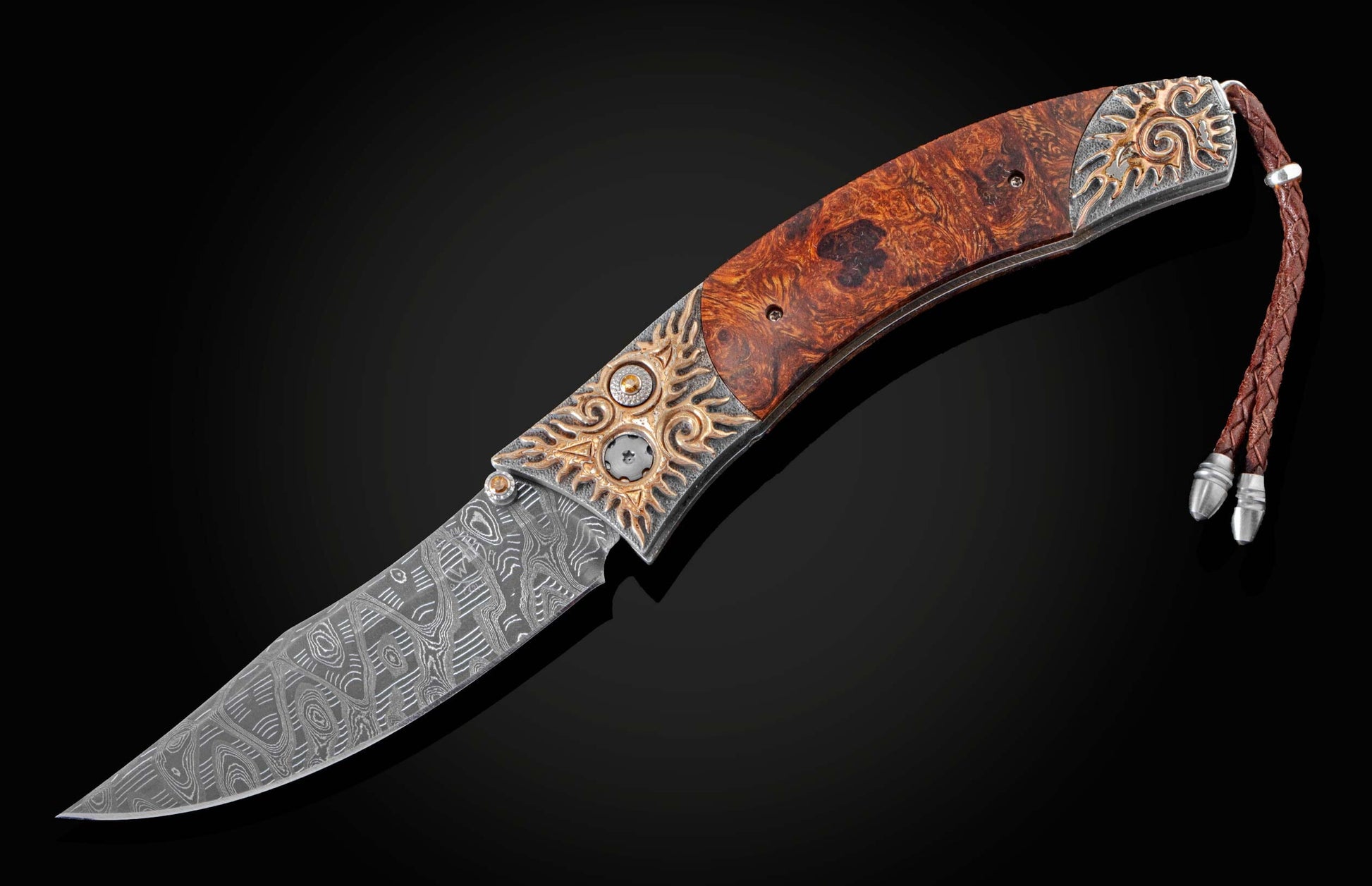 Handcrafted pocketknife from William Henry features a beautiful frame in hand-carved sterling silver with mokume gane