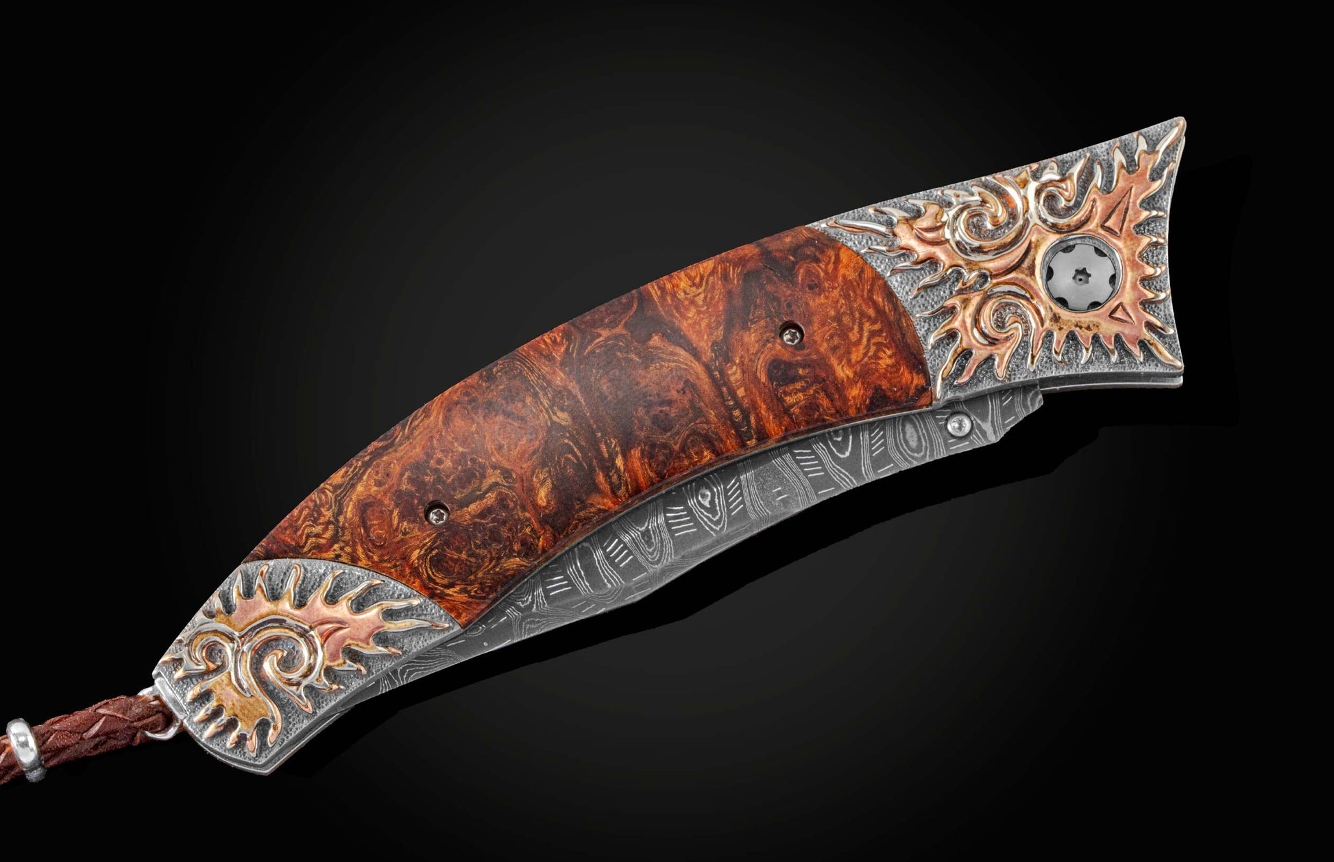  inlaid with desert ironwood and  citrine gemstones. The blade is hand-forged Damascus steel.