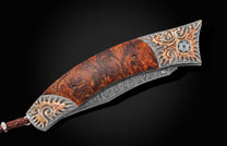 inlaid with desert ironwood and  citrine gemstones. The blade is hand-forged Damascus steel.