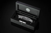  and a Damascus steel blade.