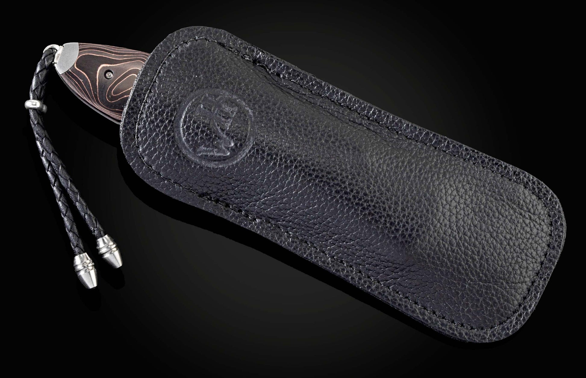  and a hand-forged Damascus steel blade by Chad Nichols.